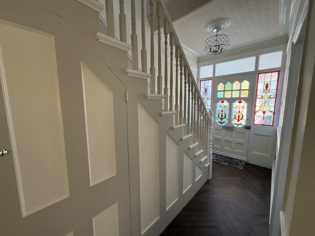 Lot: 132 - THREE-BEDROOM TERRACE HOUSE - Entrance hall looking back toward the front door